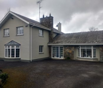 external wall coatings applied to a house front view after completion
