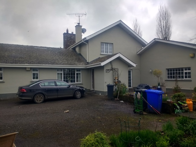 external wall coatings applied to a house rear view after completion